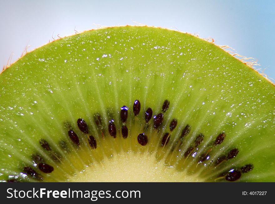 A macro photo with a kiwi slice