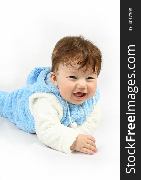 Small happy child with blue clothing against the white background. Small happy child with blue clothing against the white background
