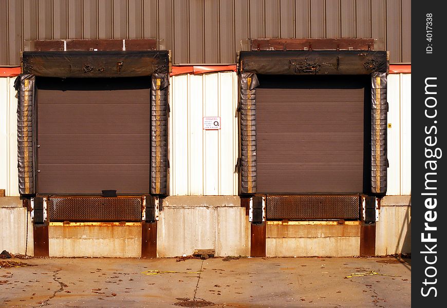 Exterior loading dock doors for the loading and unloading of shipping trailers and containers.