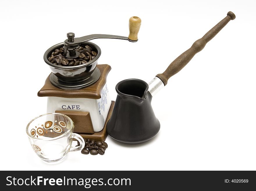 Coffee grinder, turkish coffee pot and a cup