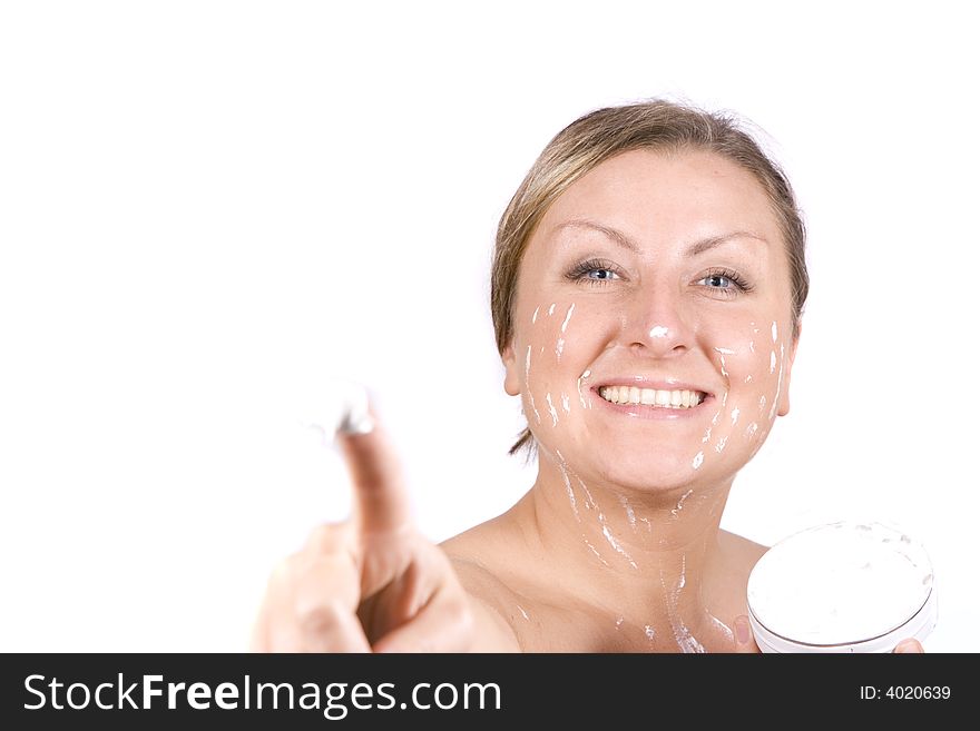 Young pretty woman smile with cream on finger - natural beauty. Young pretty woman smile with cream on finger - natural beauty