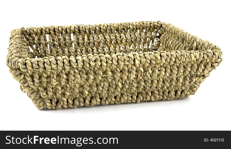 An empty wicker backet on a whith background. An empty wicker backet on a whith background.