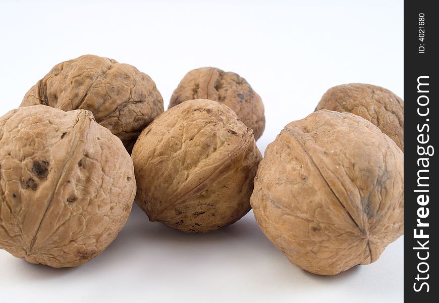 Close up of several closed walnut shells. Close up of several closed walnut shells