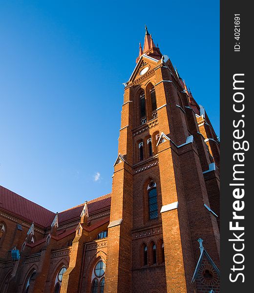 Tall old red brick church tower