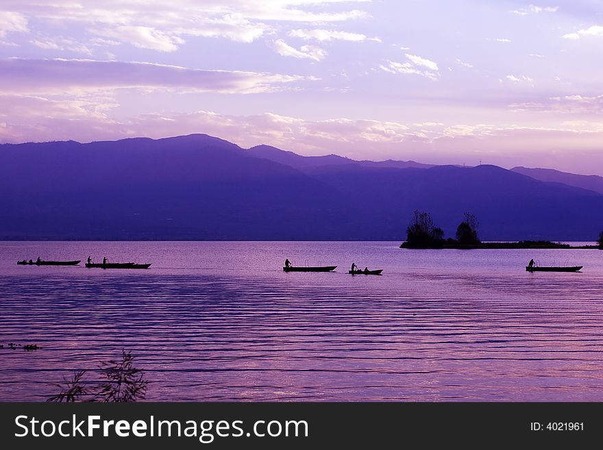 Some boats come back in dusk. Some boats come back in dusk