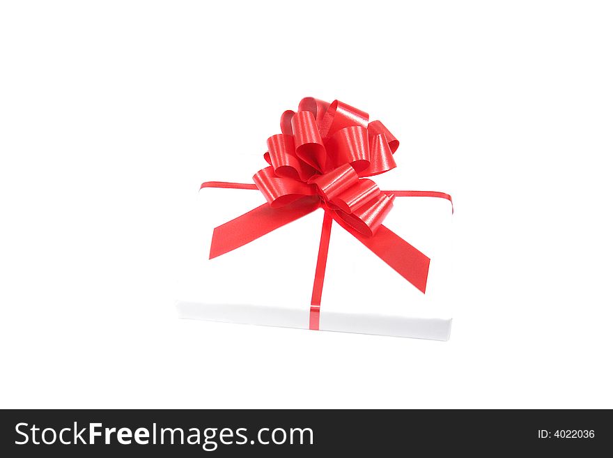 Gift box with a ribbon isolated on white. Gift box with a ribbon isolated on white