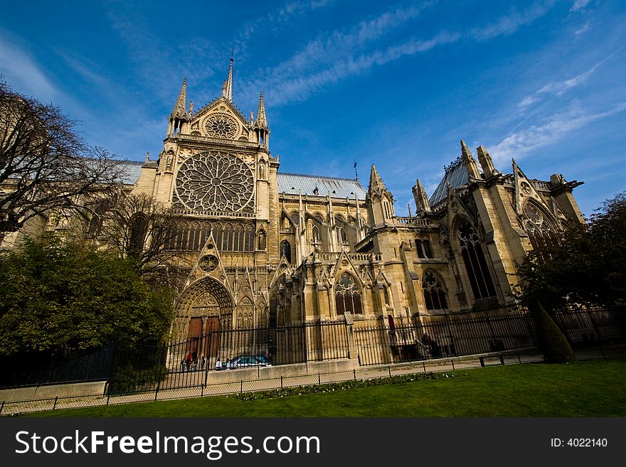 Side view of the Notre Dame cathedral in Paris, France. Side view of the Notre Dame cathedral in Paris, France.