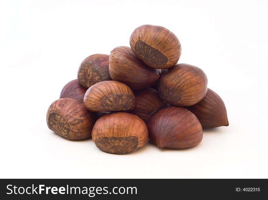 Pile of chestnuts on white background. Pile of chestnuts on white background