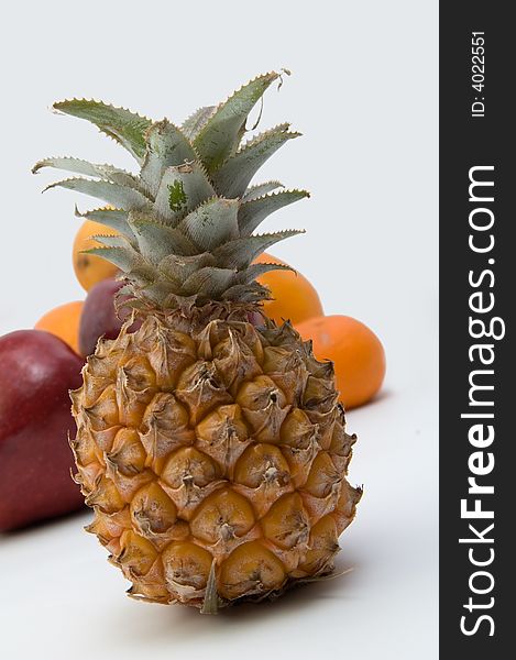 The pineapple on fruits background. The pineapple on fruits background