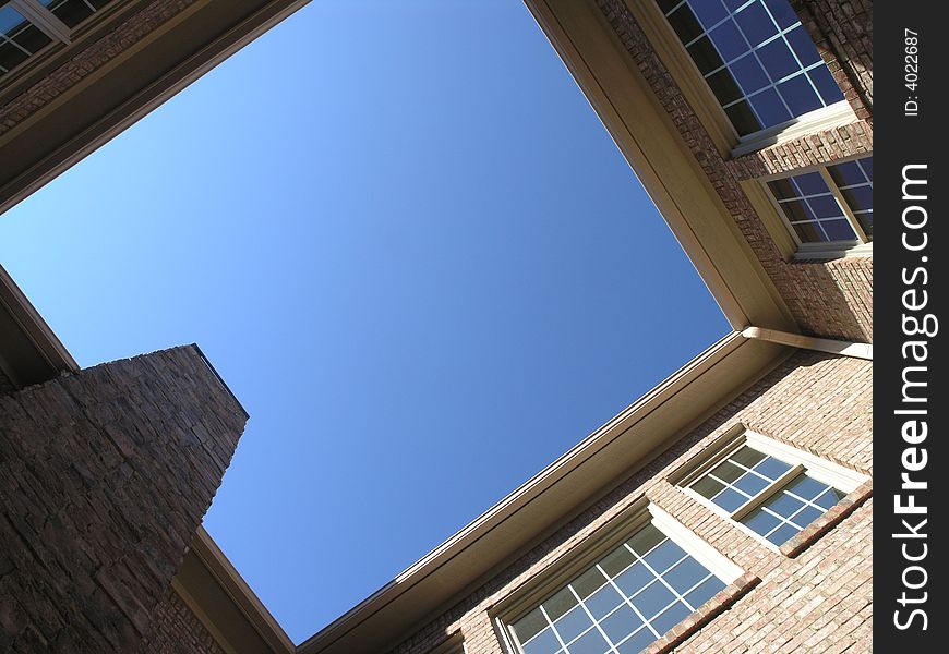 Luxury Courtyard looking up at blue sky