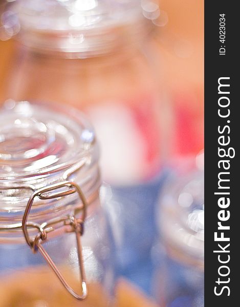 A closeup of empty air-tight glass jars with a metal clasp.