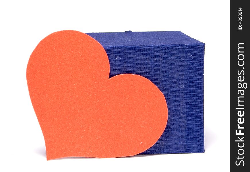 Gift Box and a large red heart. The gift of Valentine `s Day. At a homogeneous background. Gift Box and a large red heart. The gift of Valentine `s Day. At a homogeneous background.