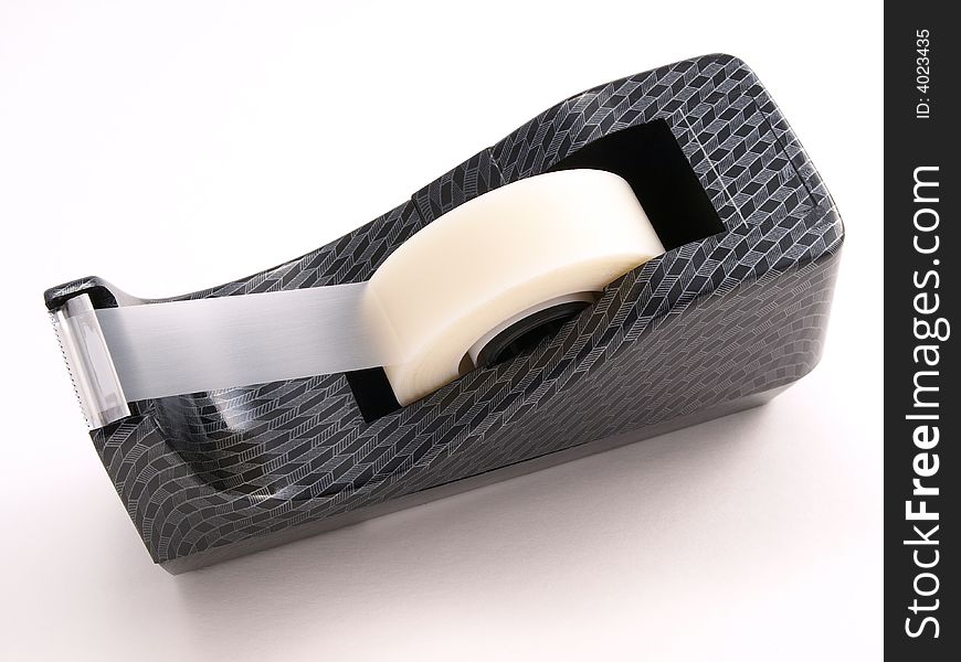 Tape dispenser with patterned design on white. Tape dispenser with patterned design on white