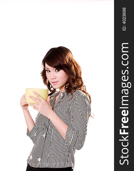 Young woman holding a big green cup with both hands smiling. Young woman holding a big green cup with both hands smiling