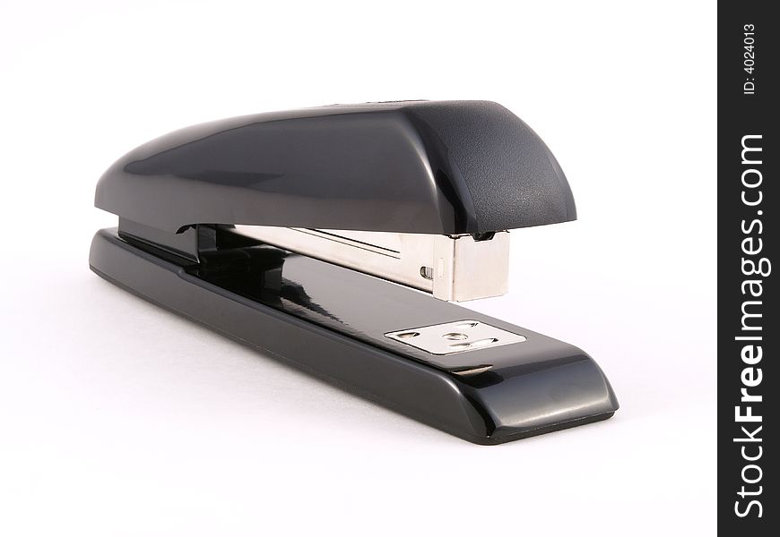 Black office stapler on white side view. Black office stapler on white side view