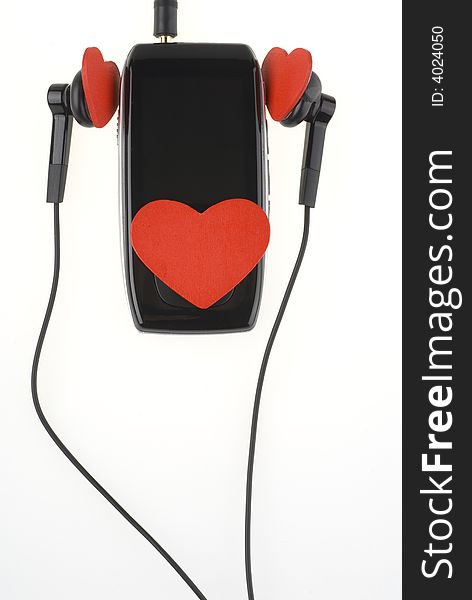 Black music player with headphones and red hearts isolated over white background. Black music player with headphones and red hearts isolated over white background.