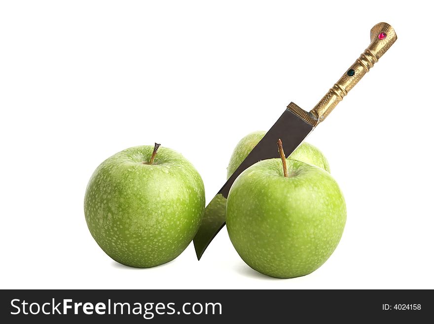 Apple and knife on white