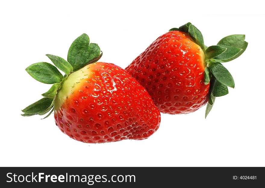 Two appetizing brightly red strawberries on a white background. Two appetizing brightly red strawberries on a white background