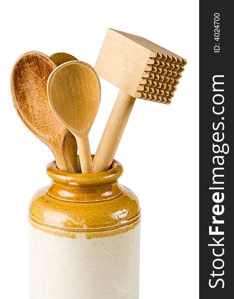 Wooden kitchen implements on a white background. Wooden kitchen implements on a white background