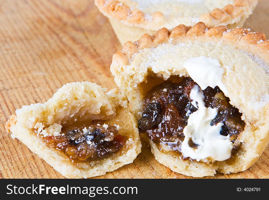 A delicious mince pie on a wooden board. A delicious mince pie on a wooden board