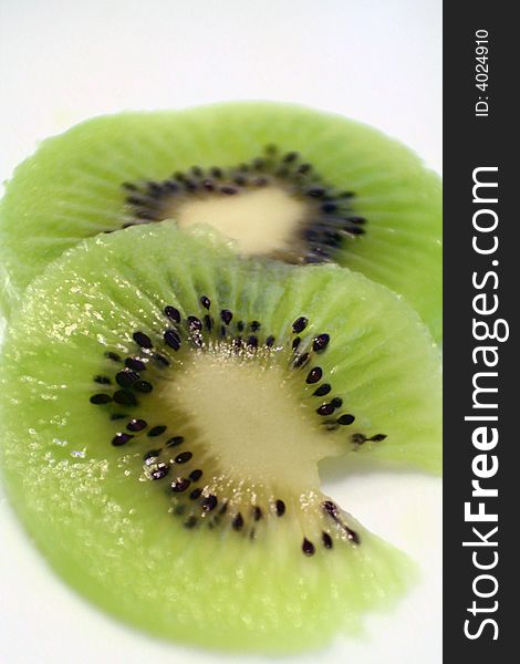 Sliced Kiwi on a white background.