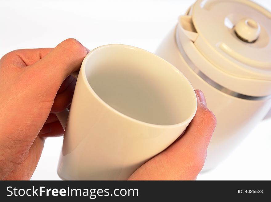 Hands holding a white mug waiting for more coffee to be poured. Hands holding a white mug waiting for more coffee to be poured