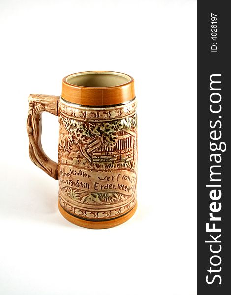 Vintage clay beer mug with decoration and legend on it