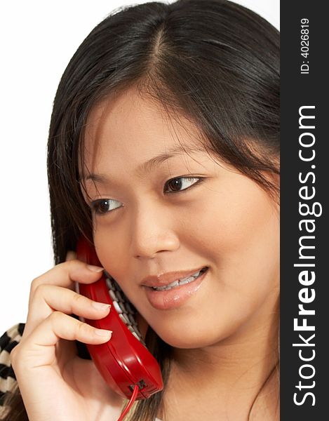 A smiling woman talking on the phone. A smiling woman talking on the phone