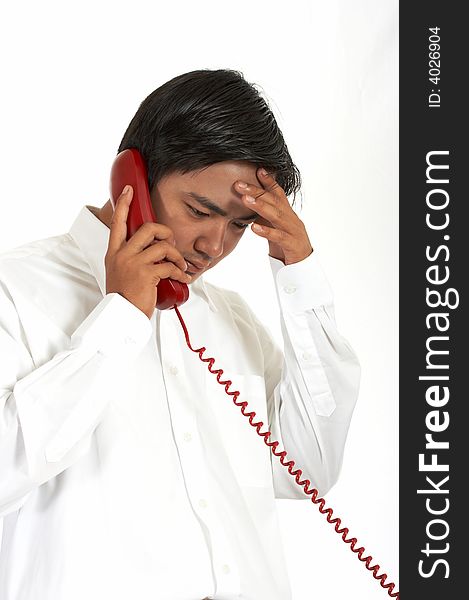 Man talking on a phone over a white background. Man talking on a phone over a white background