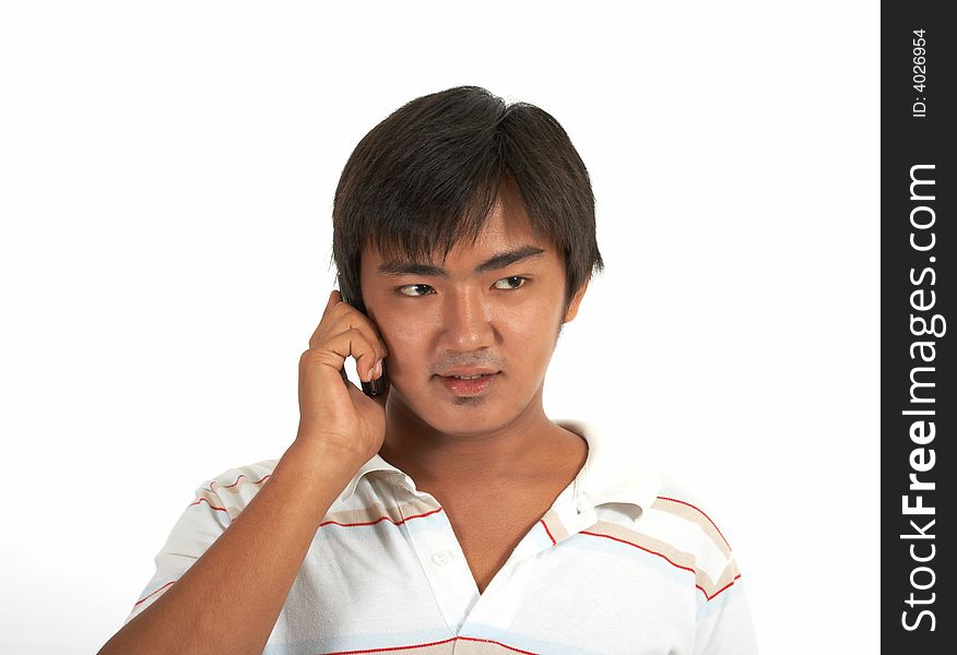 Man talking on phone over a white background. Man talking on phone over a white background
