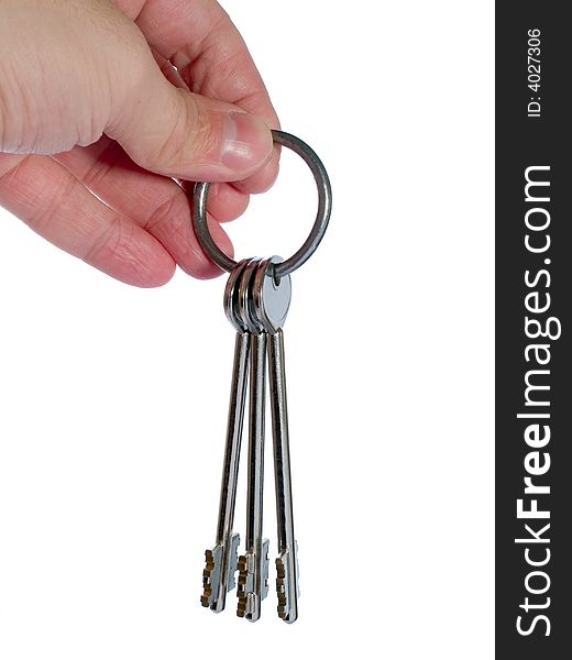 Bunch of keys on the ring in the arm isolated on white. Bunch of keys on the ring in the arm isolated on white