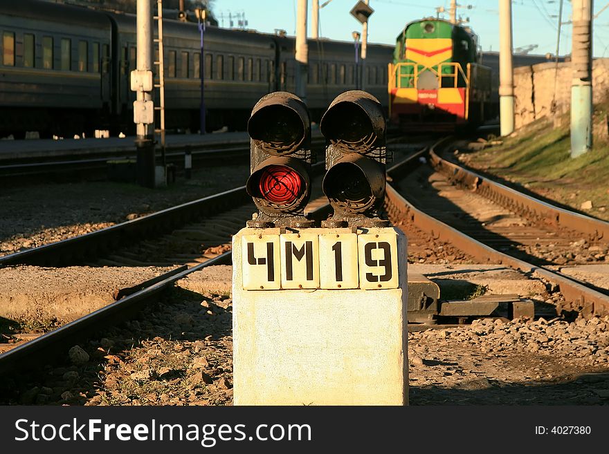 Semaphore on a fork of tracks. A red signal