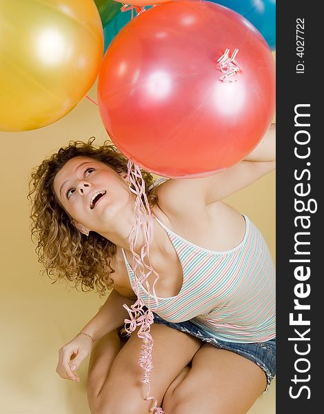 Attractive woman with balloons. Close-up portrait.