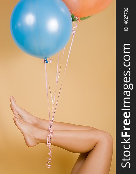 Color balloons adhered to a leg