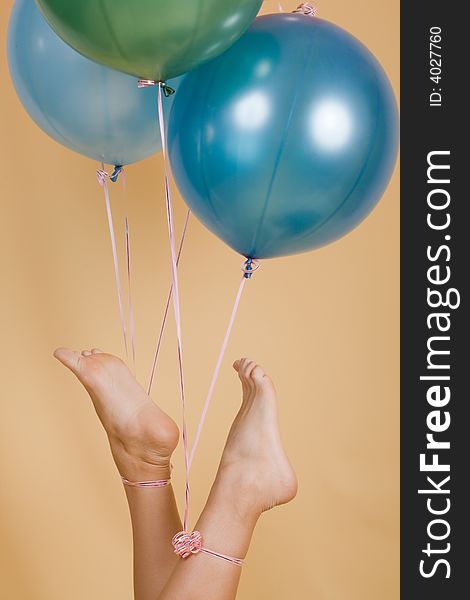 Color balloons adhered to a leg