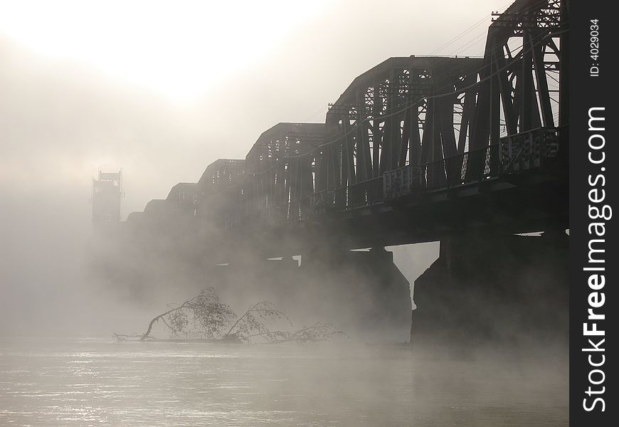 Railway bridge on an early misty morning. Railway bridge on an early misty morning.