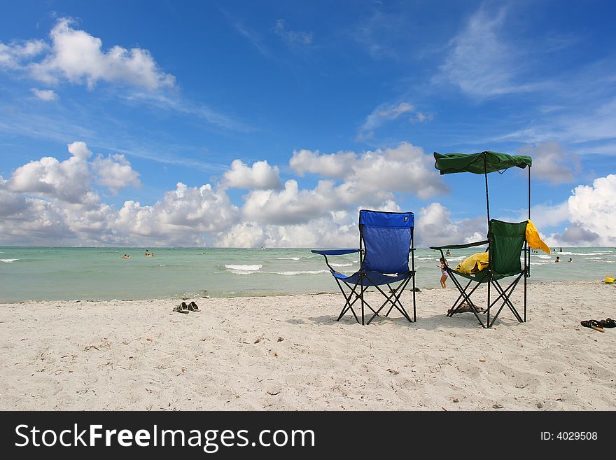 White Beach Chairs blue sky - South beach, Miami FL