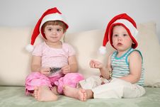 Two Children In Santa Claus Hats Stock Photos Two Children In Santa Claus Hats Stock Photos