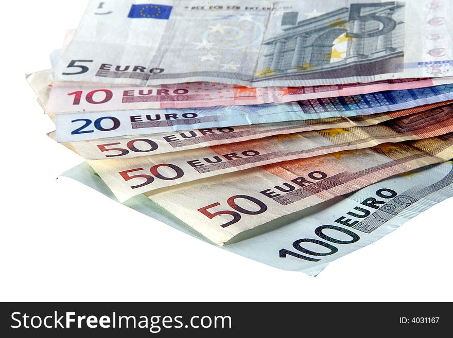 An isolated shot of Euro banknotes in all sizes. A lot of white space for text. An isolated shot of Euro banknotes in all sizes. A lot of white space for text.