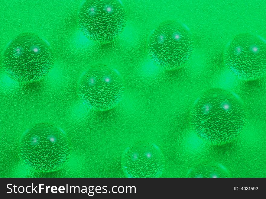 Macro shot of beautiful green water drops