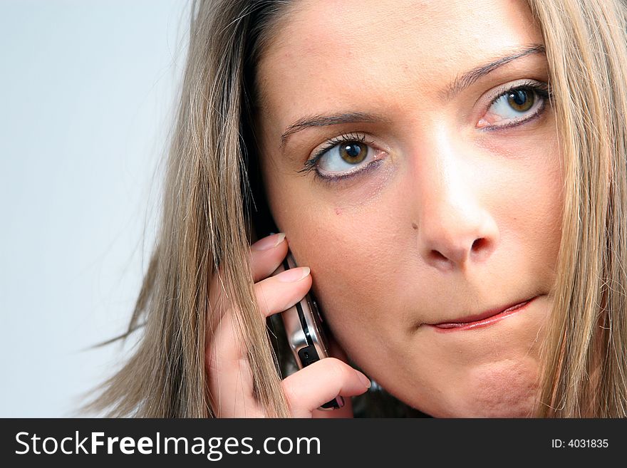 Young businesswoman is talking on mobile phone. Young businesswoman is talking on mobile phone