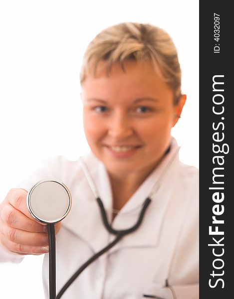 Young doctor with stethoscope (focus on stethoscope)