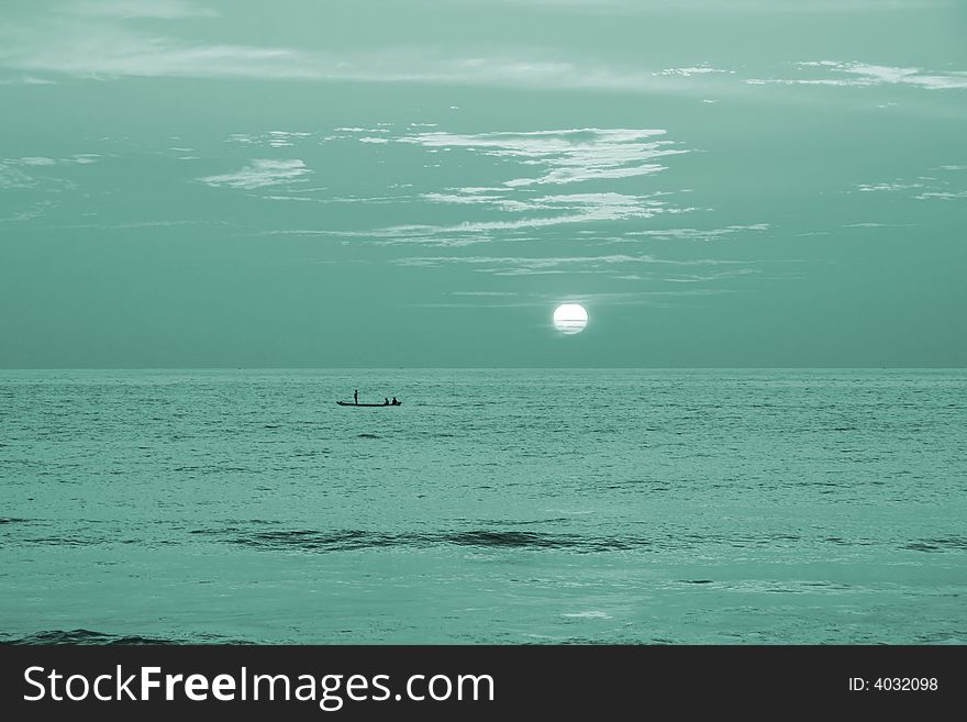Surrealistic sunset on beach, india