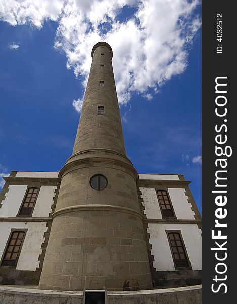 Lighthouse and blu and cloudy sky. Lighthouse and blu and cloudy sky