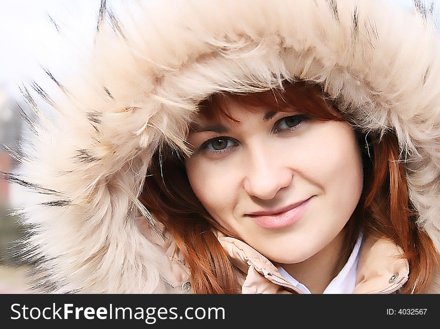 Woman smiling on a beautiful winter day. Woman smiling on a beautiful winter day.