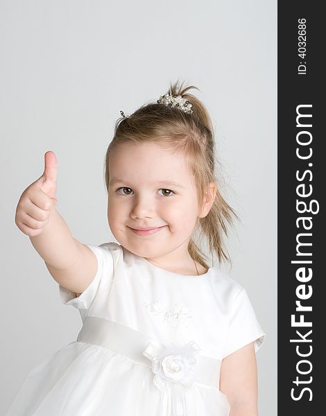 Happy little girl thumbs up