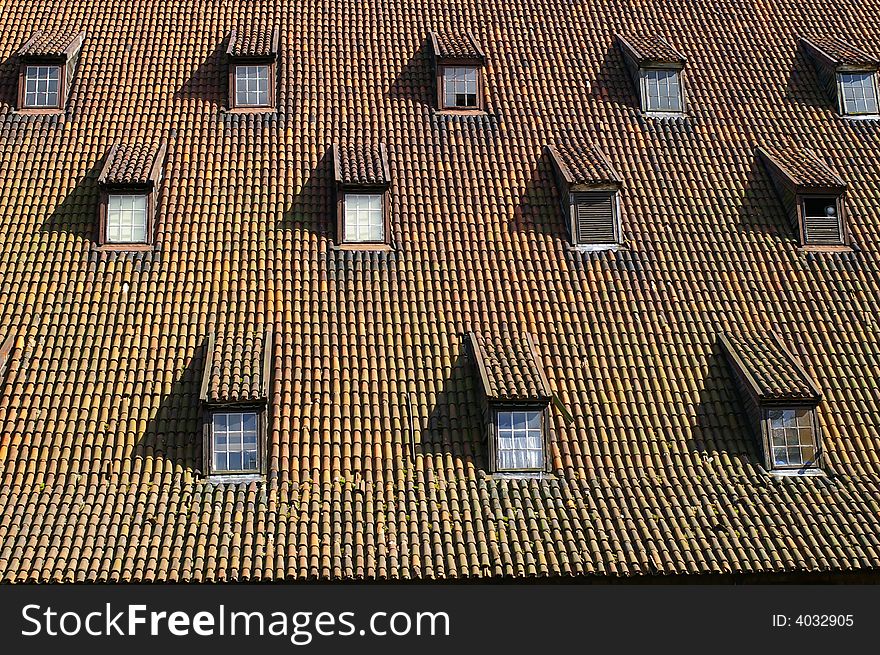 Rhythmic pattern of windows on the gothic style roof. Rhythmic pattern of windows on the gothic style roof