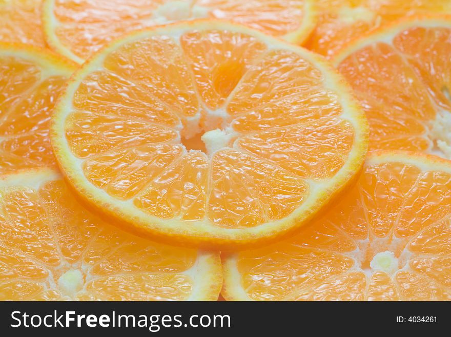 Close-up background from thin orange slices. Close-up background from thin orange slices