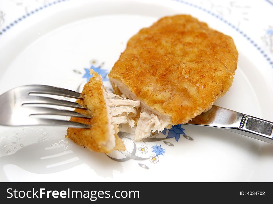 Roll white chicken meat in closeup