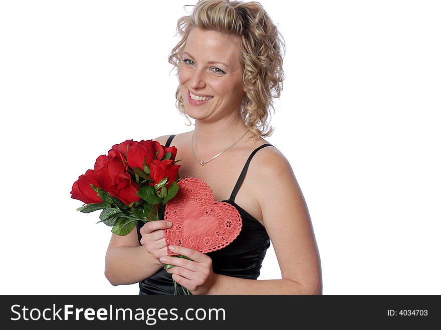 Beautiful woman holding red roses and heart on valentines day. Beautiful woman holding red roses and heart on valentines day